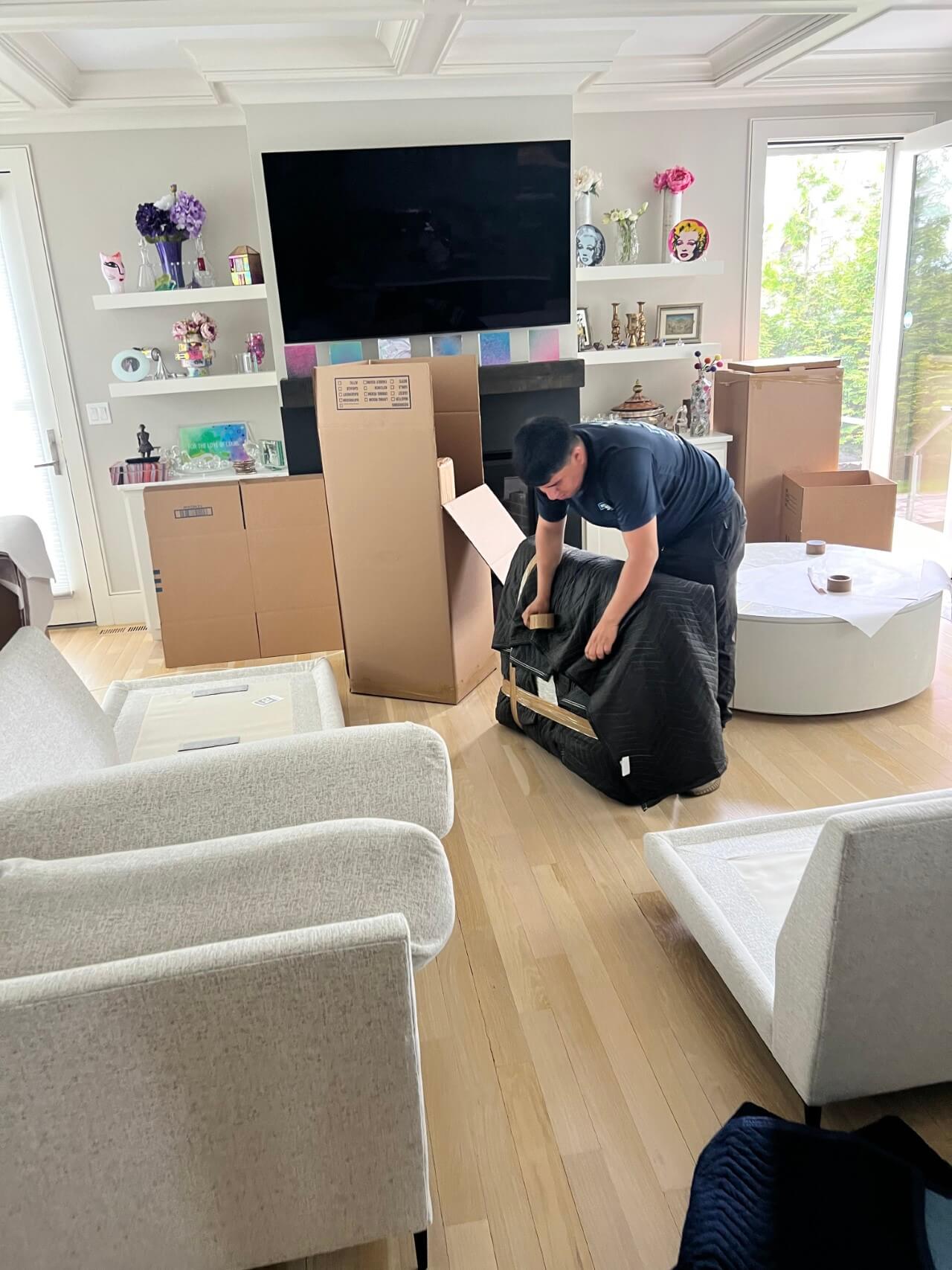 Professional movers working carefully